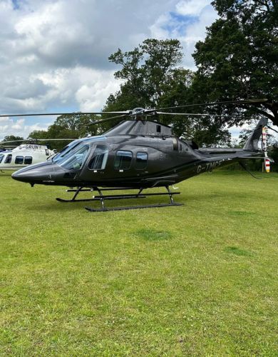 AW109 helicopter on grass at ascot